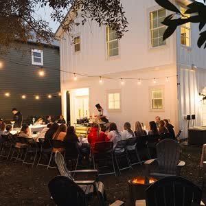 Evening hibachi dinner under string lights at a backyard on 30A