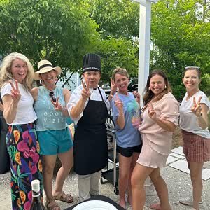 Guests posing with the hibachi chef in Santa Rosa Beach