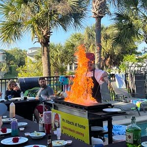 Hibachi chef’s flame show at a poolside party in Pensacola