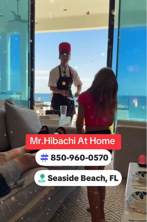 Hibachi chef cooking by a window in Seaside on 30A