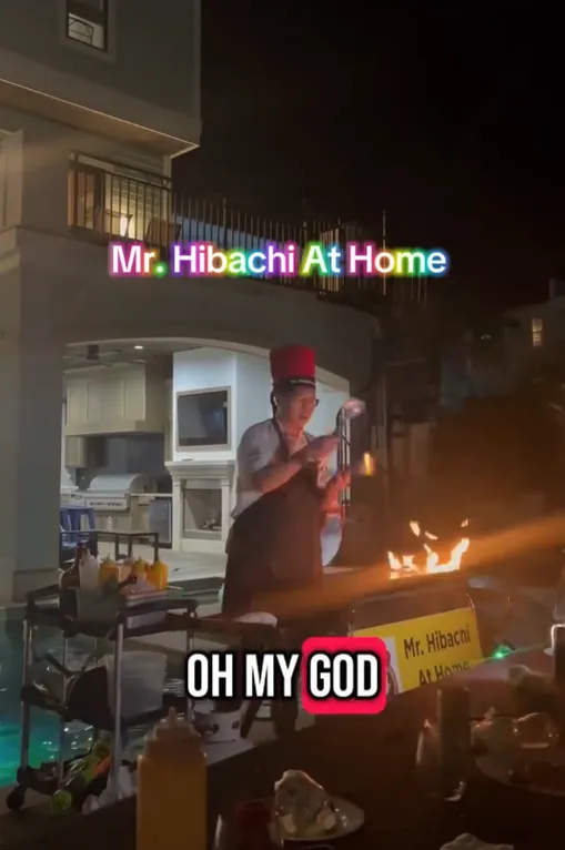 Hibachi chef’s flame show at a nighttime party
