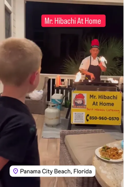 Boy watching a hibachi chef cook in Panama City Beach