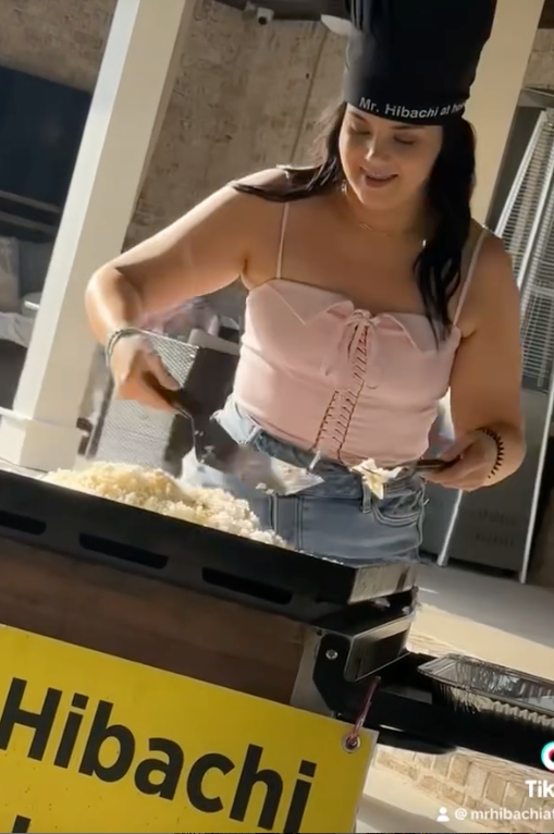 Guest trying the hibachi grill with the chef