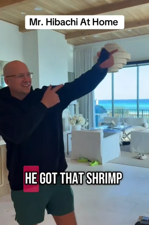 Guest catching a shrimp tossed by the hibachi chef