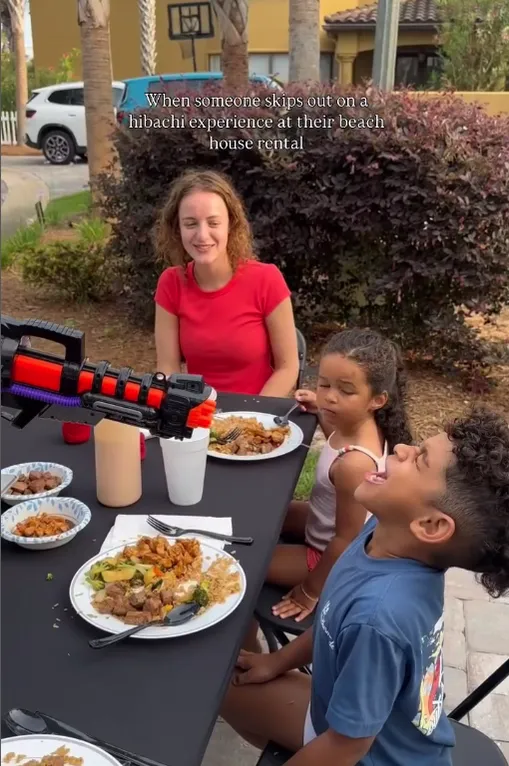 Mother and kids at an outdoor hibachi dinner table